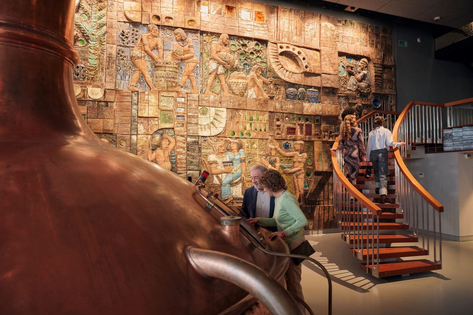 Visitantes recorren el interior de MEGA, el Museo de Estrella Galicia, en A Coruña